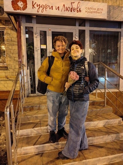 Nastya (left) and Kristina stand outside of a salon for curly hair on their last day in Moscow.