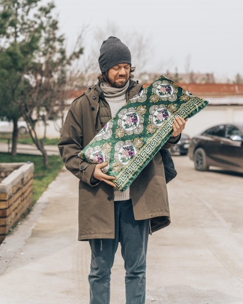 Man holding pillow 