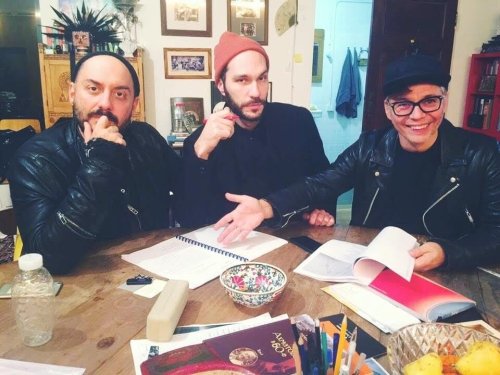 Three people around a table 