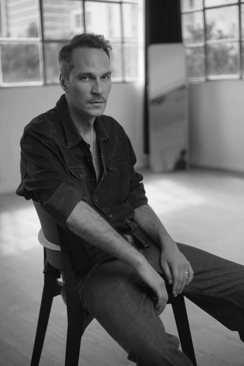 Man posing on a chair 