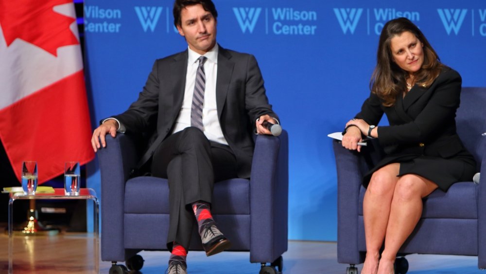 Trudeau and Freeland listening to a question