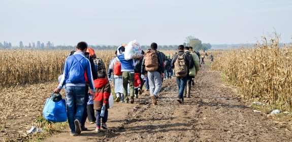 Syrian refugees crossing the border between Serbia and Croatia