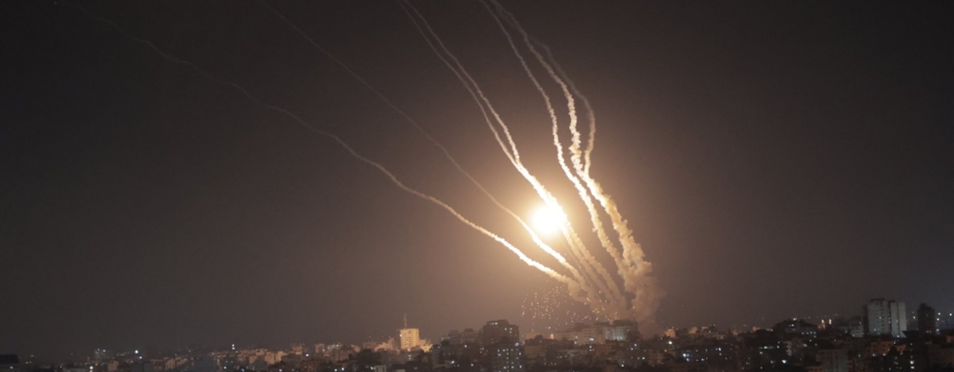 Smoke trails from rockets fired from Gaza at night