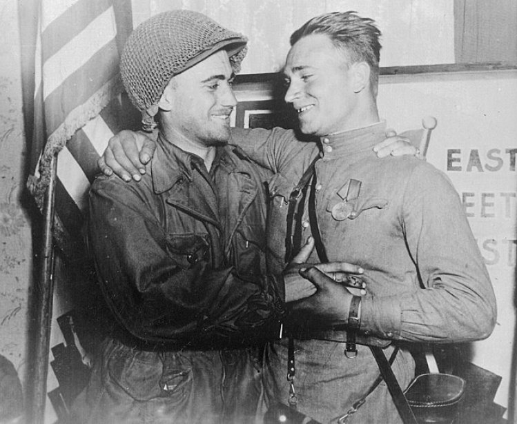 Happy 2nd Lt. William Robertson and Lt. Alexander Sylvashko, Red Army, near Torgau, Germany in April 1945. Source: US National Archives and Records Administration, #531276.