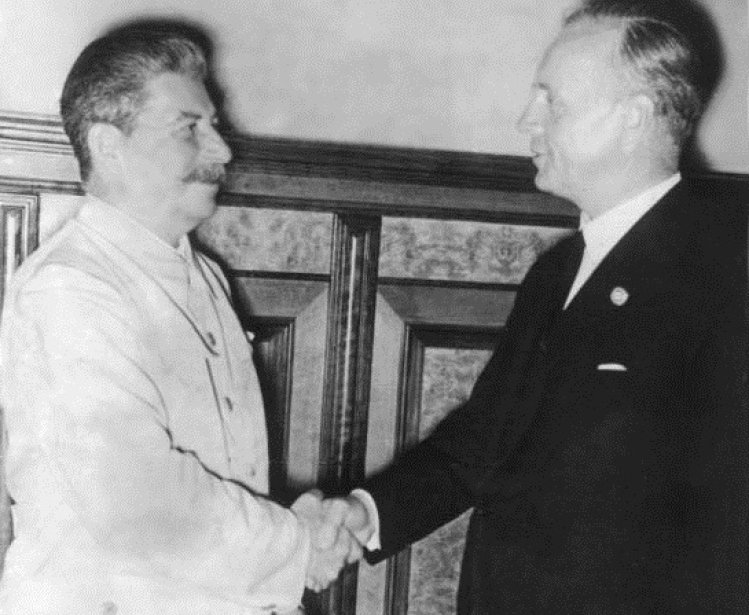 Joachim von Ribbentrop and Joseph Stalin at the signing of the Molotov–Ribbentrop Pact. Source: Wikimedia Commons.