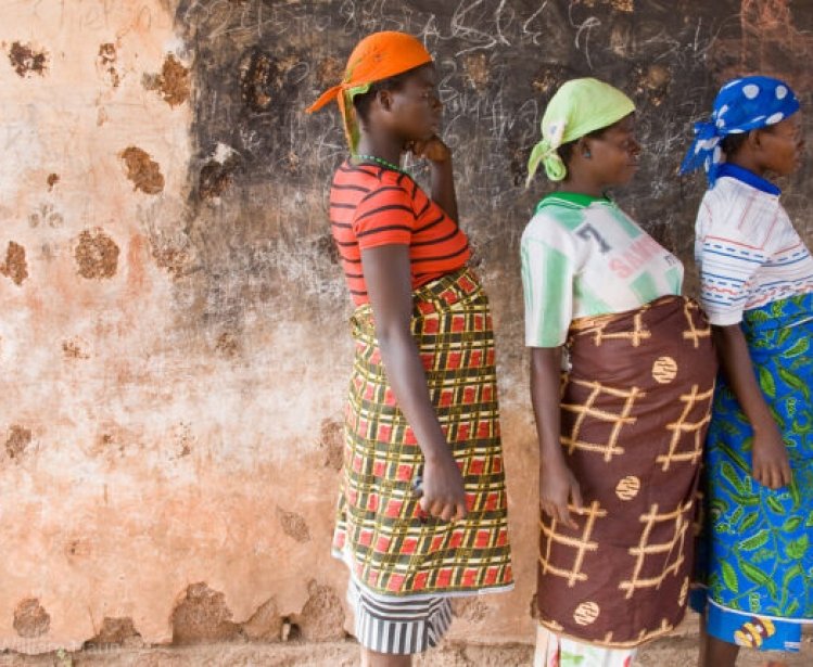 Pregnant women wait for a checkups in an abandoned schoolhouse used for mobile clinics in Gbangu-Nagbo, Ghana. 