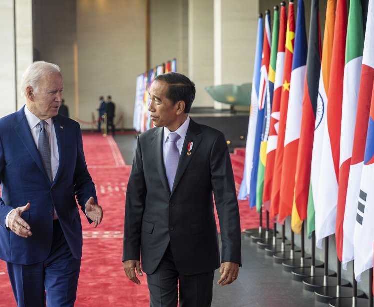 President Joe Biden walks with Indonesian President Joko Widodo as he departs the Apurva Kempinski in Bali, Indonesia