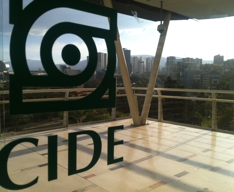 The CIDE logo on glass doors with Santa Fe in the distance