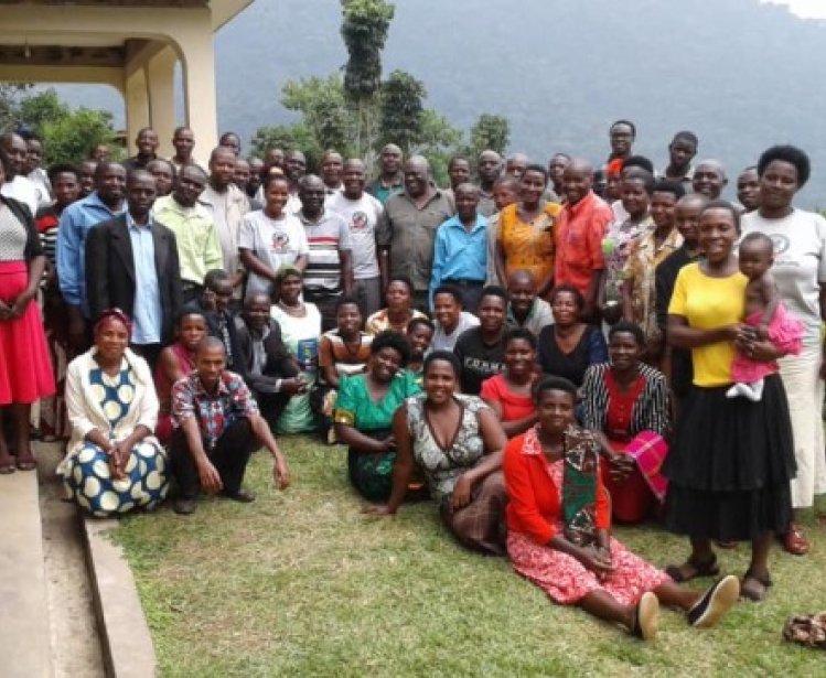 A group photo of Village Health and Conservation Teams after a training at the Gorilla Health and Community Conservation Center