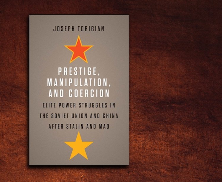 A copy of the book Prestige, Manipulation, and and Coercion by Joseph Torigian on a brown background
