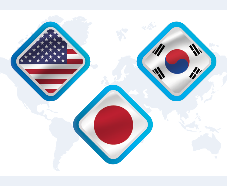 A map of the world with graphics representing the flags of the United States, Japan, and South Korea