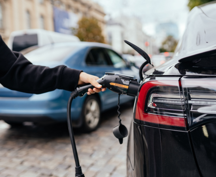 Person charging electric car