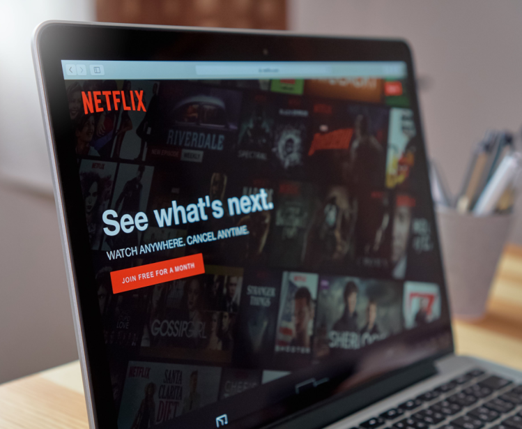 Laptop with Netflix Open Reading 'See What's Next.'