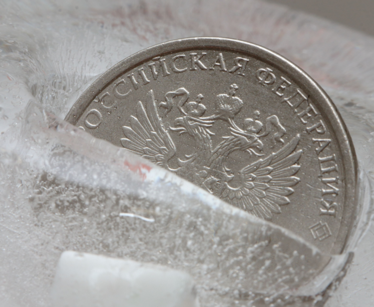Russian coin frozen in ice block
