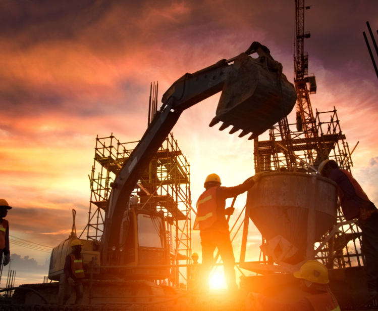 Backlit construction site with skeleton buildings