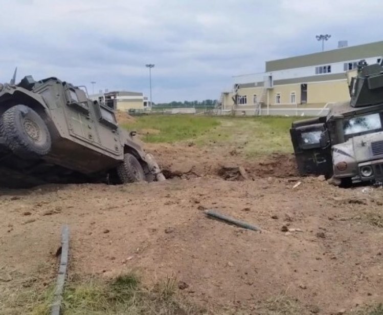 Humvees in ditch