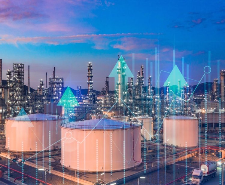 Oil​ refinery​ with oil storage tank with price graph and petrochemical​ plant industrial background at twilight, Aerial view oil and gas refinery at twilight.