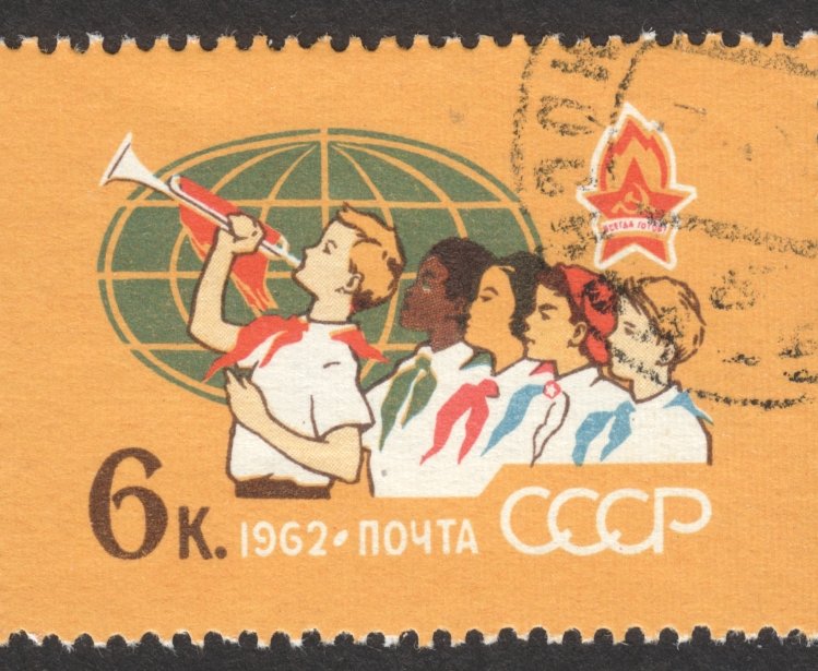  CIRCA NOVEMBER 2018: a post stamp printed in the USSR shows Pioneers of Different Peoples, Globe, the series "The 40th Anniversary of All-Union Lenin Pioneer Organization", circa 1962