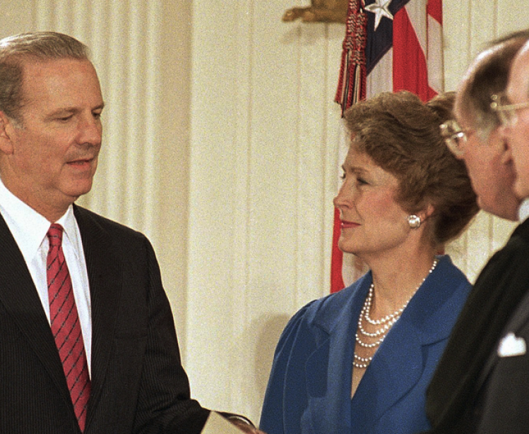 Susan Baker smiles at her husband, James Baker III, as he is sworn in as Secretary of State at the White House in Washington on Friday, Jan. 28, 1989 during a reenactment of the ceremony. Chief Justice William Rehnquist swears Baker in, second from right as President George H. Bush looks on, right. Baker was officially sworn in a private ceremony on Wednesday at the State Department. 
