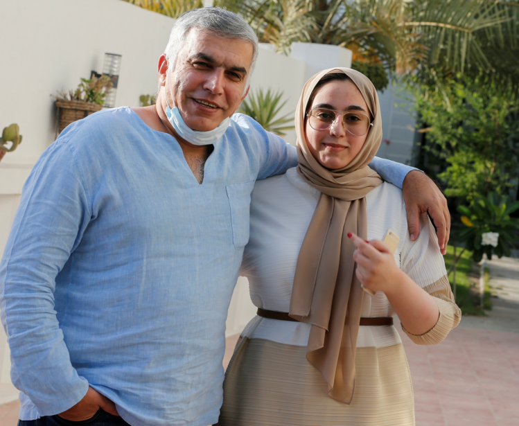 Nabeel Rajab and his daughter pose after he is freed from prison