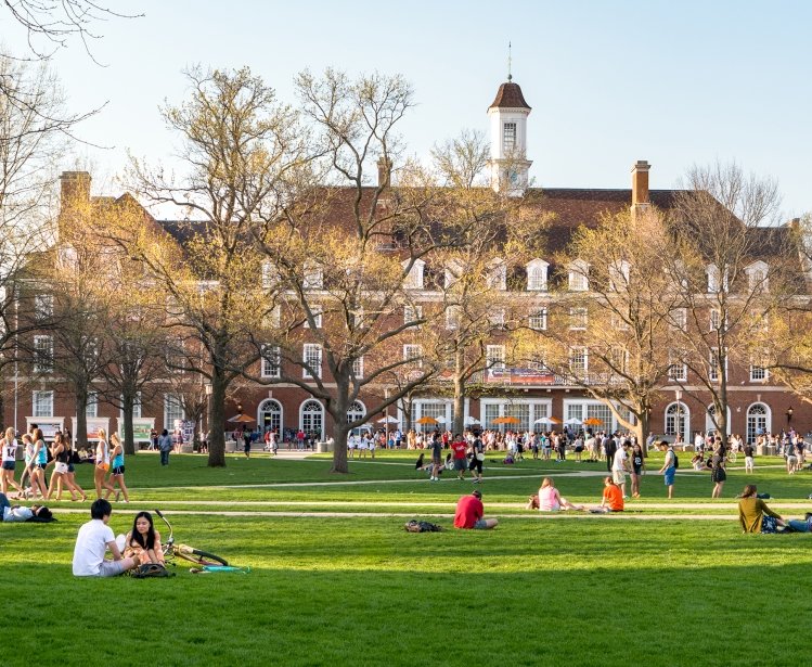  Students mingle on Quad lawn of University of Illinois college campus in Urbana Champaign