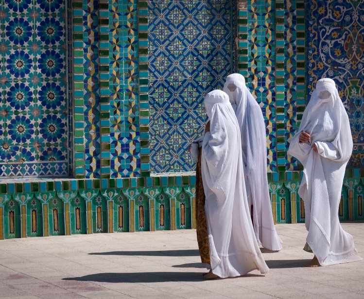 Women in burqas at a mosque