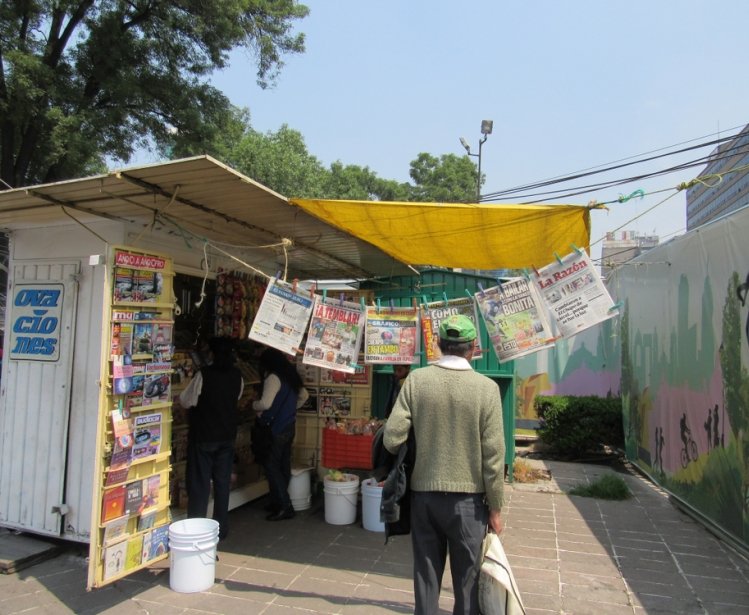 Mexico City/Mexico-5/9/16: A man approaches a newsstand on Avenida Paseo de la Reforma. 