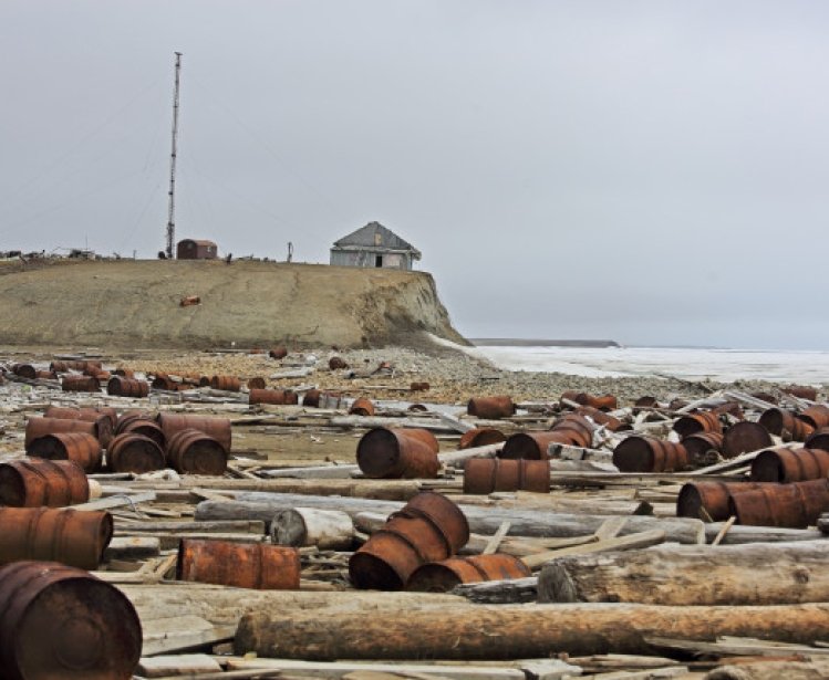 Rusty fuel and chemical drums in the Arctic.
