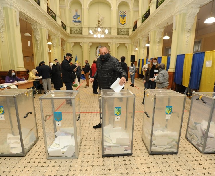25 October 2020 People vote at at polling station during local elections in Lviv, Ukraine 