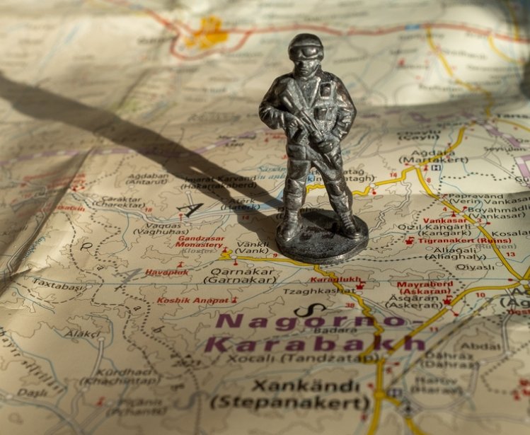 A figure soldier standing on a map of Nagorno-Karabakh