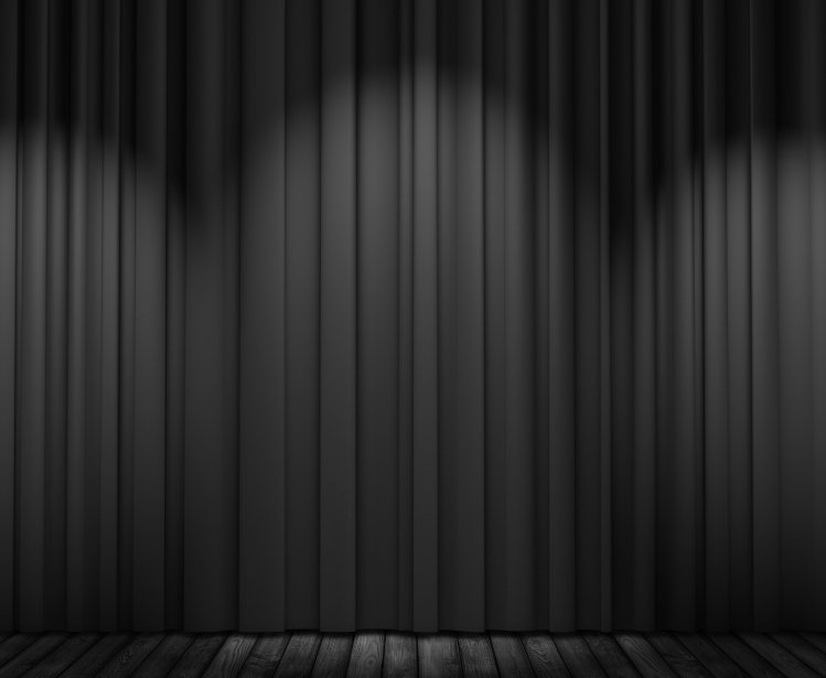Black theatre curtains with three spotlights