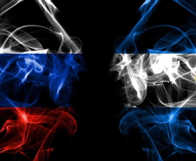 Russian and Nicaraguan Flags in Smoke