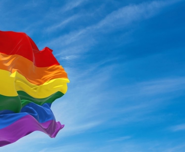 LGBTQ+ Flag on blue sky