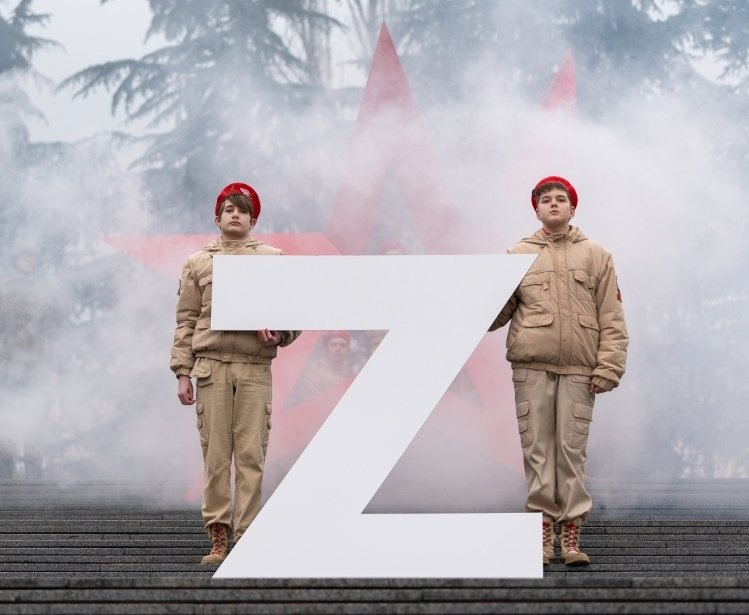 Soldiers standing with a large Z