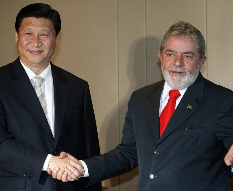Then Chinese Vice-President Xi Jinping (L) shakes hands with Brazilian President Luiz Inacio Lula da Silva, during a meeting in Brasilia, Brazil on February 19, 2009.
