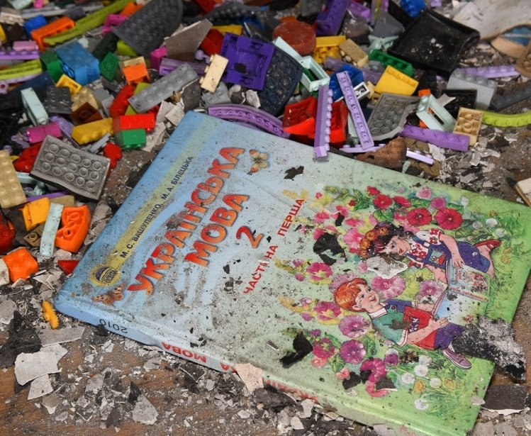 Ukrainian Children's Book on top of rubble