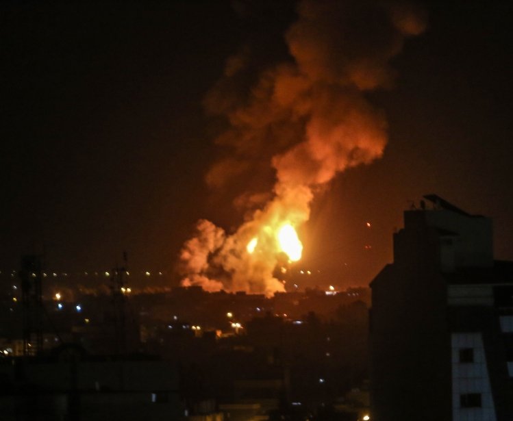 A ball of flames erupted after the Israeli warplanes bombed a military site of the Martyr Izz al-Din al-Qassam Brigades, the military wing of Hamas, in Rafah, in southern Gaza Strip, on May 3, 2023.
