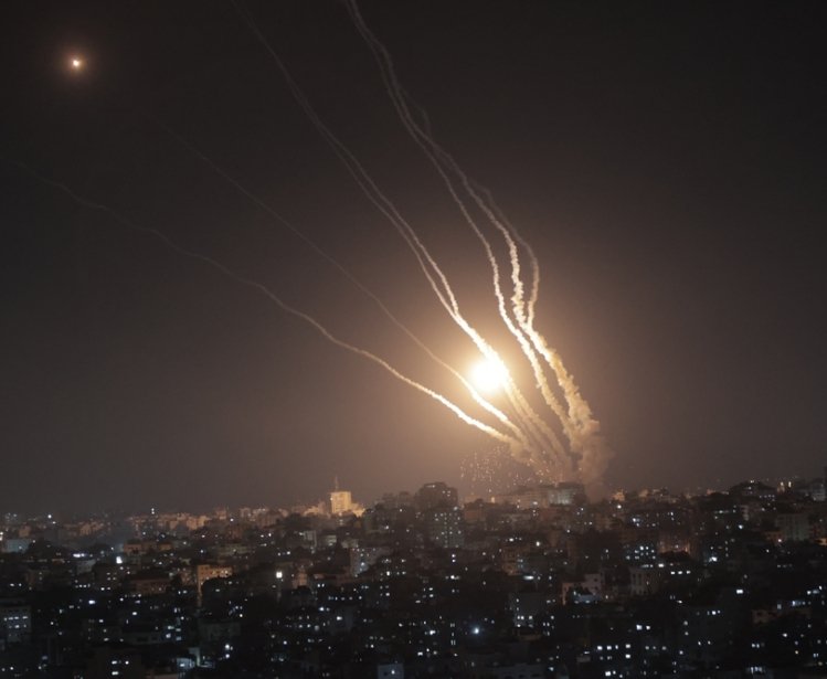 Smoke trails from rockets fired from Gaza at night
