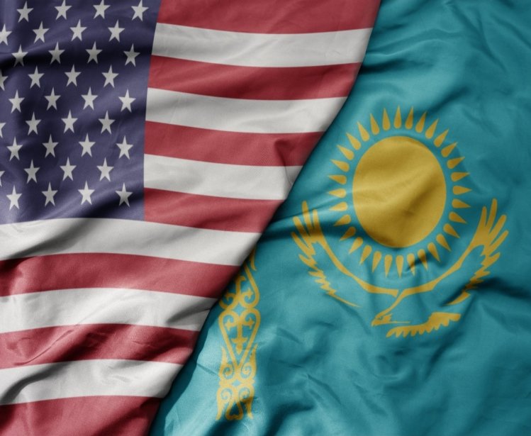 big waving flag of united states of america and national flag of kazakhstan