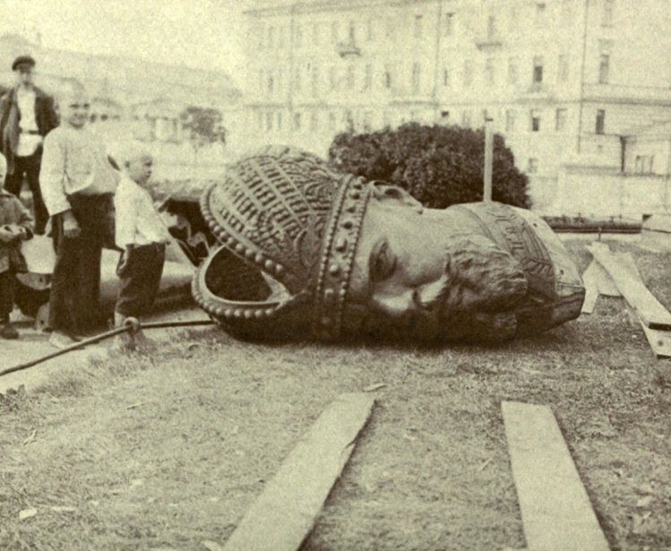 Historical photo of a toppled statue 