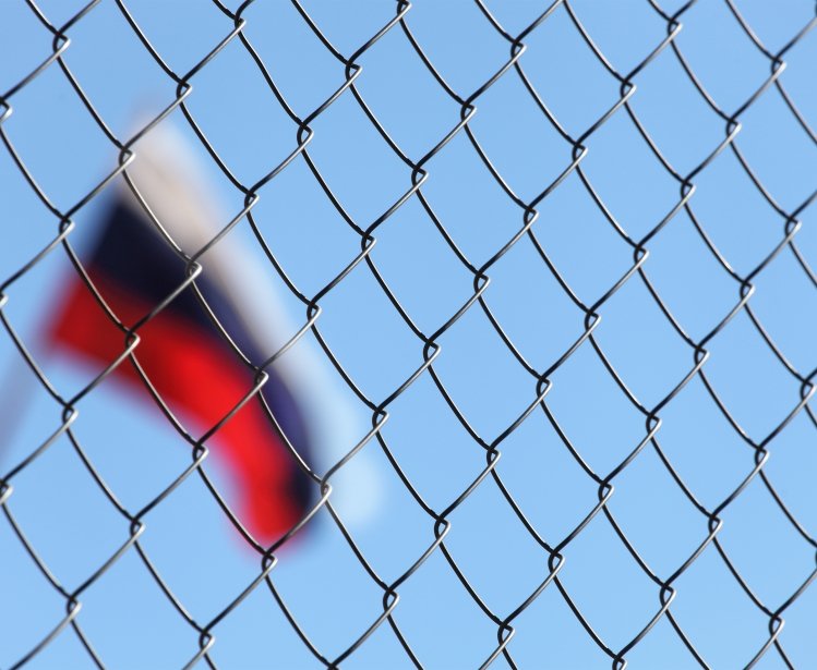 The Russian flag behind fence