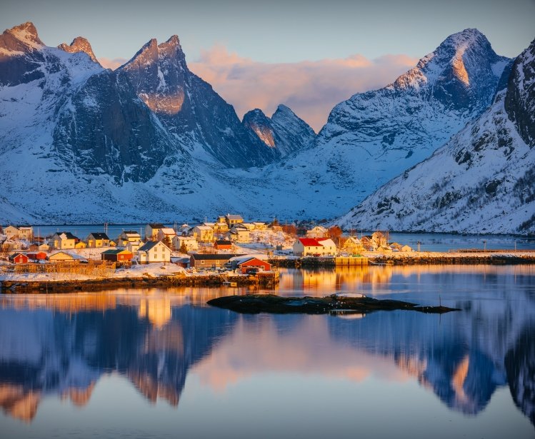 Colorful winter sunrise in the fishing village of Reine, Lofoten archipelago, Norway, above the arctic circle