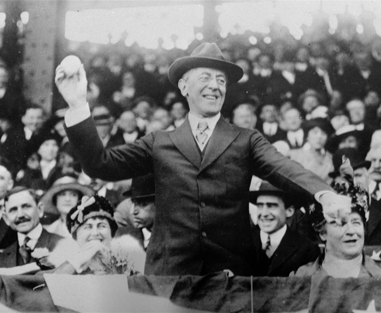 Surrounded by crowds, President Woodrow Wilson throws out the first ball at a baseball game in Washington in this 1916 photo. (AP Photo)