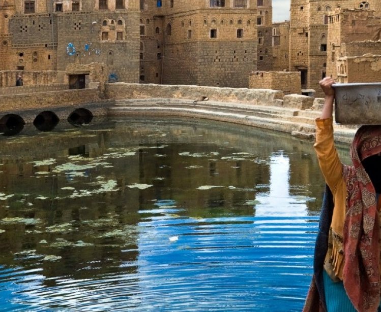 An unidentified woman uses a public fountain basin on May 5, 2007 in Thula, Yemen. Among other arabic countries, in 2012 Yemen became a site of civil conflicts.
