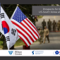 A screencap showing Dr. Kim Joonhyung speaking with an image of South Korean and U.S. flags in the background.