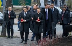 Ukrainian President Volodymyr Zelenskyy and his wife, Olena Zalenska, hold candles as they walk to a memorial in Independence Square in Kyiv, Ukraine. Source: President.gov.ua