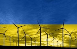 Ukrainian flag superimposed over wind turbines