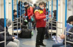 Health workers on a Moscow subway car.