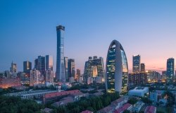 A photo of the Beijing skyline at dusk.