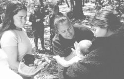 Midwife Mel Briggs working with new mom and baby in New South Wales, Australia.